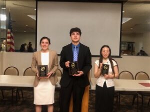 Three High School Pro Life Oratory Contest winners holding their award plaques.