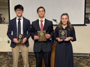Three High School Pro Life Oratory Contest winners holding their award plaques.